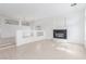 Open-concept living room featuring a fireplace, high ceilings, and stylish chandelier at 9339 Bondeno St, Las Vegas, NV 89123