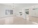 Spacious living room with modern light fixture, connecting two sides of the house and featuring a fireplace at 9339 Bondeno St, Las Vegas, NV 89123