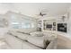 Spacious living room featuring a built-in entertainment center and fireplace with plenty of natural light at 9339 Bondeno St, Las Vegas, NV 89123