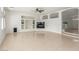 Bright open living room with fireplace, built-in shelves, and backyard access at 9339 Bondeno St, Las Vegas, NV 89123