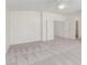 Neutral colored Primary bedroom with neutral carpet, ceiling fan, and ensuite bathroom entrance at 9339 Bondeno St, Las Vegas, NV 89123