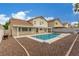Beautiful backyard with a sparkling pool and a patio area for entertaining and relaxation at 9339 Bondeno St, Las Vegas, NV 89123