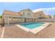 Refreshing backyard pool with clean lines and a covered patio, perfect for relaxing and entertaining at 9339 Bondeno St, Las Vegas, NV 89123