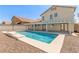Inviting backyard pool with a modern design, ideal for hot days and outdoor enjoyment at 9339 Bondeno St, Las Vegas, NV 89123