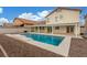 Backyard pool with a covered patio provides a relaxing outdoor space at 9339 Bondeno St, Las Vegas, NV 89123