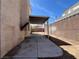 Spacious backyard with concrete patio and shade cover perfect for entertaining at 1001 Padre Island St, Las Vegas, NV 89128