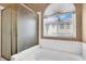 This bathroom features a soaking tub and a separate glass-enclosed shower at 1001 Padre Island St, Las Vegas, NV 89128