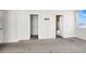 A bedroom features doorways to a closet and the bathroom, and a large window at 1001 Padre Island St, Las Vegas, NV 89128