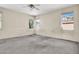 A large bedroom features a ceiling fan, natural light from multiple windows at 1001 Padre Island St, Las Vegas, NV 89128