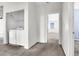 A laundry room with a washer and dryer next to a doorway to a bedroom, next to a door at 1001 Padre Island St, Las Vegas, NV 89128