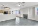 Open-concept kitchen/living room area featuring a cozy fireplace and a breakfast bar at 1001 Padre Island St, Las Vegas, NV 89128