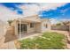 Fenced backyard with a covered patio and low-maintenance landscaping at 1069 Silver Bullet Ct, Henderson, NV 89011