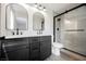 Bathroom features double vanity, modern fixtures, and a glass enclosed walk-in shower at 1069 Silver Bullet Ct, Henderson, NV 89011