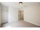 Bright bedroom featuring neutral carpet, a sliding door closet, and an overhead light fixture at 1069 Silver Bullet Ct, Henderson, NV 89011