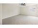 Spacious bedroom with plush neutral carpet, ceiling fan and good natural light at 1069 Silver Bullet Ct, Henderson, NV 89011
