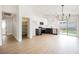 Open kitchen/living area with stainless appliances, white cabinets, and backyard access at 1069 Silver Bullet Ct, Henderson, NV 89011