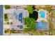 Aerial view of a home featuring solar panels, a pool, and a full basketball court at 10726 Hawes End Ct, Las Vegas, NV 89183