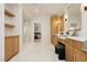 Bright bathroom featuring double sinks, a vanity area and a walk-in shower at 10726 Hawes End Ct, Las Vegas, NV 89183