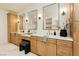 Bright bathroom features double vanities, framed mirrors, marble floors, and a vanity seat at 10726 Hawes End Ct, Las Vegas, NV 89183