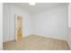 Bright, open bedroom featuring a wood floor, white walls, and abundant natural light at 10726 Hawes End Ct, Las Vegas, NV 89183