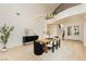 Dining room showcasing a modern chandelier, grand staircase, and stylish decor at 10726 Hawes End Ct, Las Vegas, NV 89183