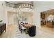 Dining room featuring an elegant light fixture, staircase, and views of the kitchen at 10726 Hawes End Ct, Las Vegas, NV 89183