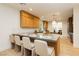 Bright kitchen with an island that doubles as a breakfast bar, custom cabinets, and stainless steel appliances at 10726 Hawes End Ct, Las Vegas, NV 89183
