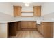 Modern kitchenette with wooden cabinets and white countertops, perfect for a smaller space at 10726 Hawes End Ct, Las Vegas, NV 89183