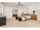 Inviting bedroom with a king bed, wood floors, designer furnishings, and great natural light at 10726 Hawes End Ct, Las Vegas, NV 89183