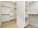 Walk-in closet features bright white shelving and wood flooring at 10726 Hawes End Ct, Las Vegas, NV 89183