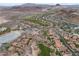 Aerial view of residential neighborhood with lush green golf course at 1111 Casa Palermo Cir, Henderson, NV 89011