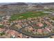 Panoramic aerial view of residential neighborhood with a golf course backdrop at 1111 Casa Palermo Cir, Henderson, NV 89011
