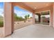 Relaxing covered back patio with desert landscaping and privacy fence at 1111 Casa Palermo Cir, Henderson, NV 89011