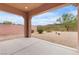 Inviting covered back patio with desert landscaping and mountain views at 1111 Casa Palermo Cir, Henderson, NV 89011