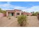 Private backyard featuring desert landscaping and a covered patio area at 1111 Casa Palermo Cir, Henderson, NV 89011