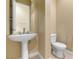 Elegant powder room featuring a pedestal sink and neutral color palette at 1111 Casa Palermo Cir, Henderson, NV 89011