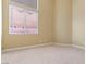 Cozy carpeted bedroom with natural light from a large window at 1111 Casa Palermo Cir, Henderson, NV 89011