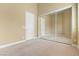 Bright carpeted bedroom with a mirrored closet and natural lighting at 1111 Casa Palermo Cir, Henderson, NV 89011