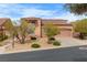 Charming single-Gathering home featuring a tile roof, desert landscaping, and an attached two-car garage at 1111 Casa Palermo Cir, Henderson, NV 89011