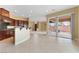 Spacious kitchen featuring dark wood cabinetry, granite countertops, and stainless steel appliances at 1111 Casa Palermo Cir, Henderson, NV 89011