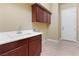 Spacious laundry room with cabinets and a sink at 1111 Casa Palermo Cir, Henderson, NV 89011