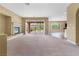 Comfortable living room featuring a fireplace and sliding doors that provide access to the outdoor area at 1111 Casa Palermo Cir, Henderson, NV 89011