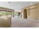 Bright living area with sliding glass doors that offer picturesque views and access to the backyard at 1111 Casa Palermo Cir, Henderson, NV 89011