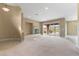 Spacious living room with a fireplace and sliding glass doors offering great views of the yard at 1111 Casa Palermo Cir, Henderson, NV 89011