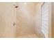 Tiled walk-in shower with a glass block window at 1111 Casa Palermo Cir, Henderson, NV 89011
