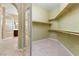 Walk-in closet offering ample storage with built-in shelving at 1111 Casa Palermo Cir, Henderson, NV 89011