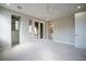 Bright bedroom with neutral tones, walk-in closet, and French doors to outdoor terrace at 11359 Winter Cottage Pl, Las Vegas, NV 89135