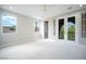 Spacious bedroom with ample natural light, neutral tones, and access to a private balcony at 11359 Winter Cottage Pl, Las Vegas, NV 89135