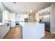Modern kitchen with white cabinetry, stainless steel appliances, and a large center island at 11359 Winter Cottage Pl, Las Vegas, NV 89135
