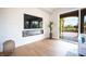 Stylish living room featuring a contemporary fireplace and access to a backyard at 11359 Winter Cottage Pl, Las Vegas, NV 89135